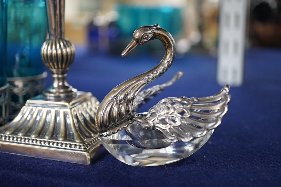 Four coloured glasses with silver stands a similar glass swan salt, a three piece cruet with white metal mounts and a plated single stem epergne, glasses and stands 9cm high., Condition - good